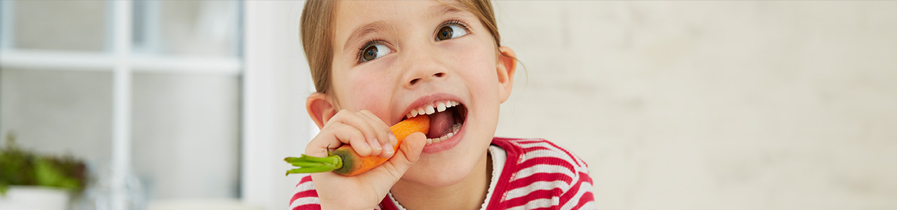 Child Eating Carrot Header Child Eating Carrot Header